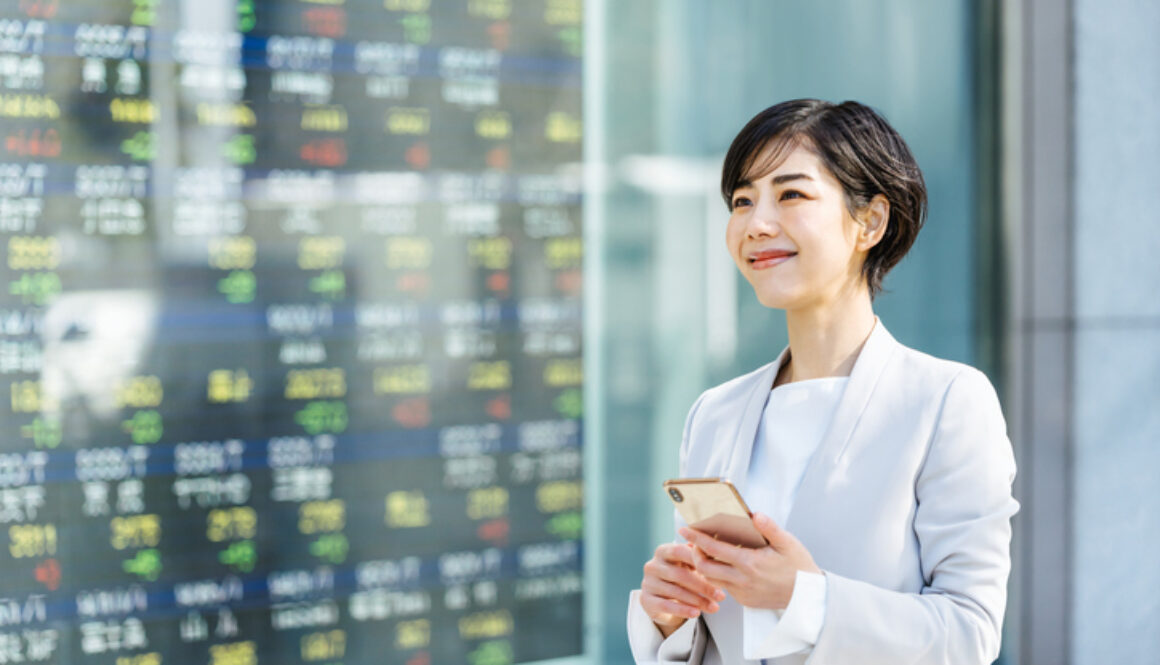 woman looking at stock market board